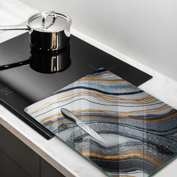 Protège plaque de cuisson rocher avec de l'or