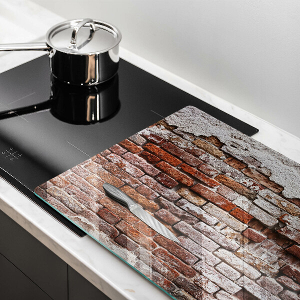 Protection plaque induction Vieux mur de brique et de béton