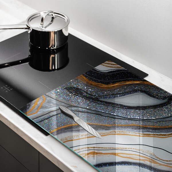 Cache plaque de cuisson rocher avec de l'or