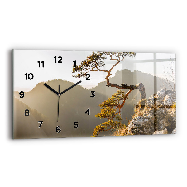 Horloge rectangulaire horizontale Un arbre dans les montagnes