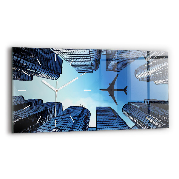 Horloge rectangulaire horizontale Avion au-dessus des bâtiments