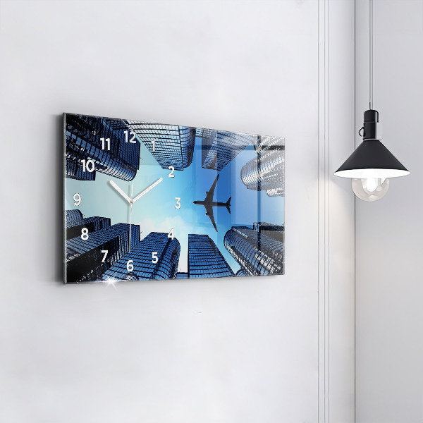 Horloge rectangulaire horizontale Avion au-dessus des bâtiments