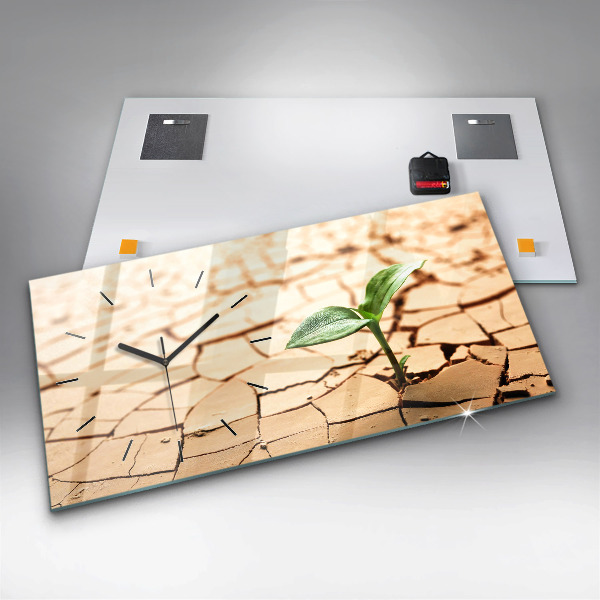 Horloge rectangulaire horizontale Une plante dans un sol asséché