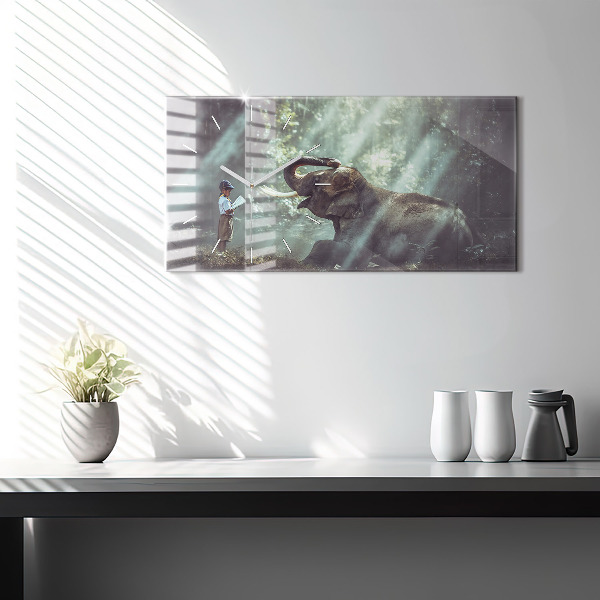 Horloge murale horizontale Un garçon lit un livre