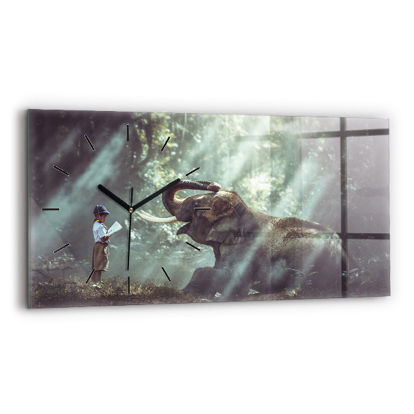 Horloge murale horizontale Un garçon lit un livre