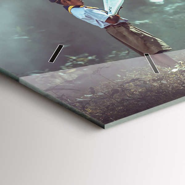 Horloge murale horizontale Un garçon lit un livre