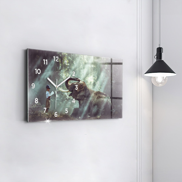 Horloge murale horizontale Un garçon lit un livre