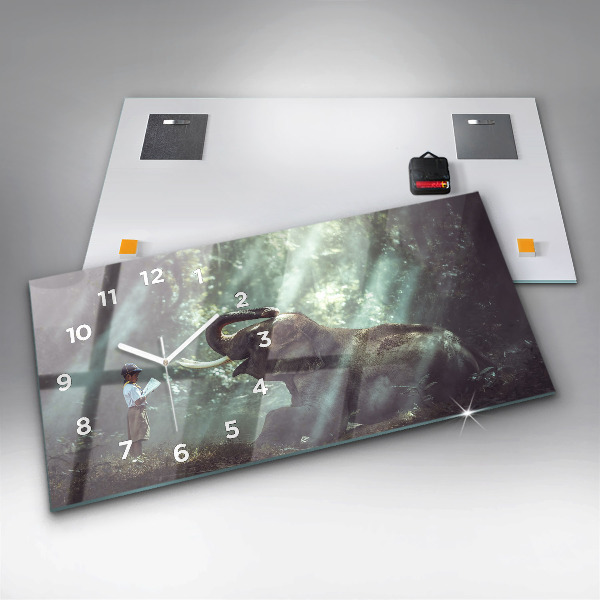 Horloge murale horizontale Un garçon lit un livre