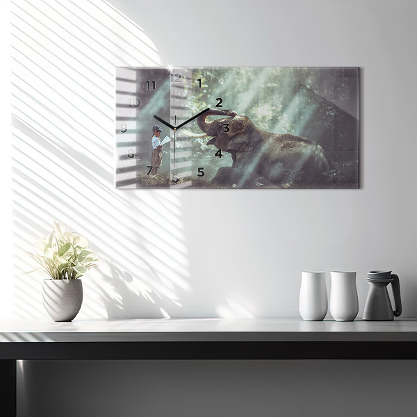 Horloge murale horizontale Un garçon lit un livre