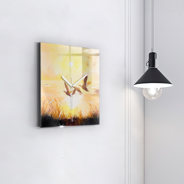 Pendule carrée en verre Grues au coucher du soleil