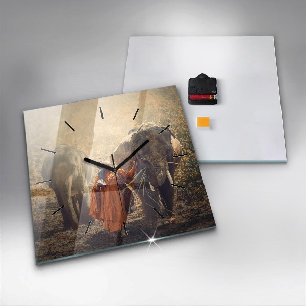 Horloge murale carrée Moine conduisant des éléphants