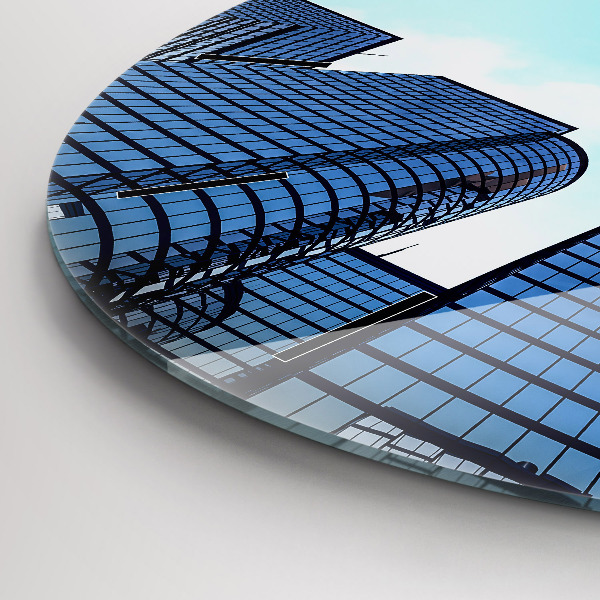 Horloge ronde Avion au-dessus des bâtiments