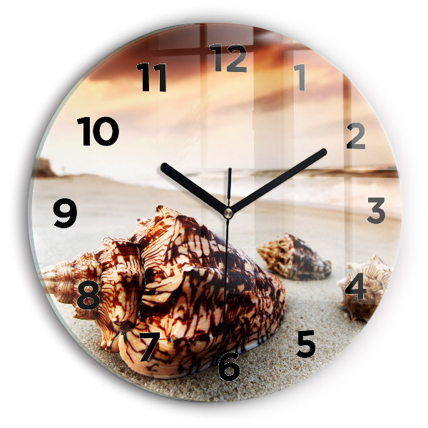 Horloge ronde Un coquillage sur la plage
