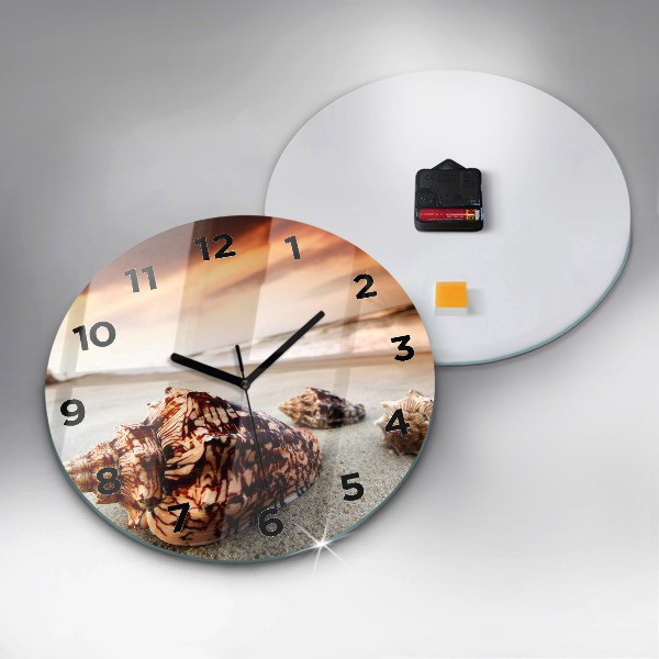Horloge ronde Un coquillage sur la plage
