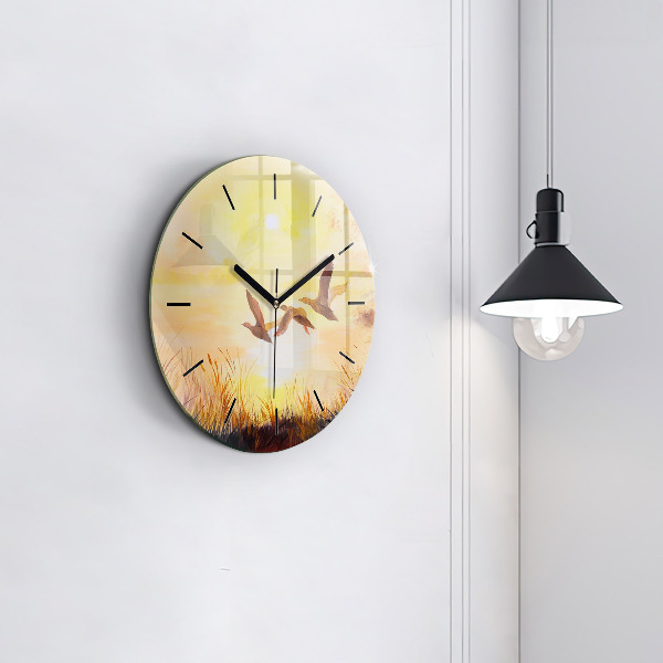 Pendule murale ronde Grues au coucher du soleil