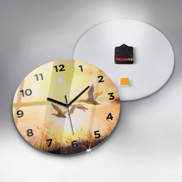 Pendule murale ronde Grues au coucher du soleil