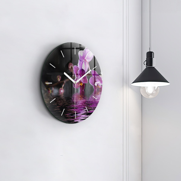 Horloge ronde 'Fleur d''orchidée sur l''eau'