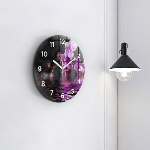 Horloge ronde 'Fleur d''orchidée sur l''eau'