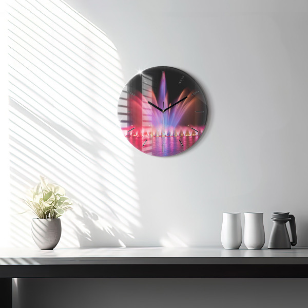 Horloge ronde Fontaine de Wroclaw la nuit