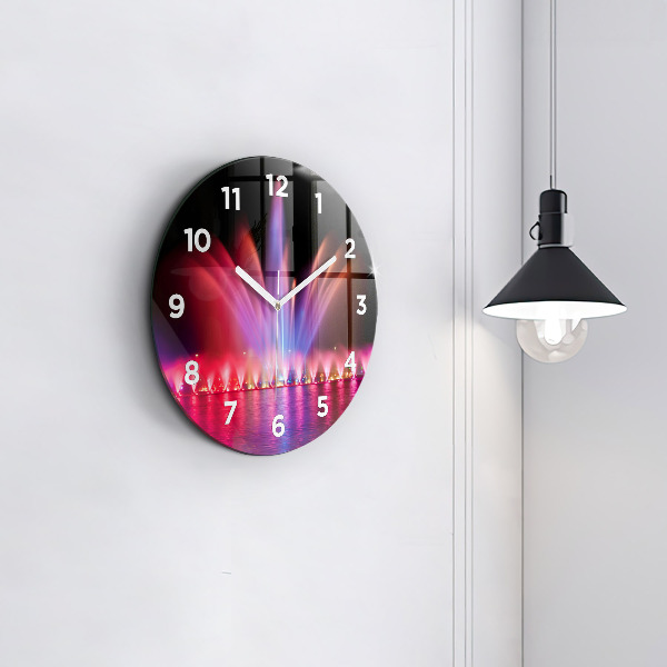 Horloge ronde Fontaine de Wroclaw la nuit