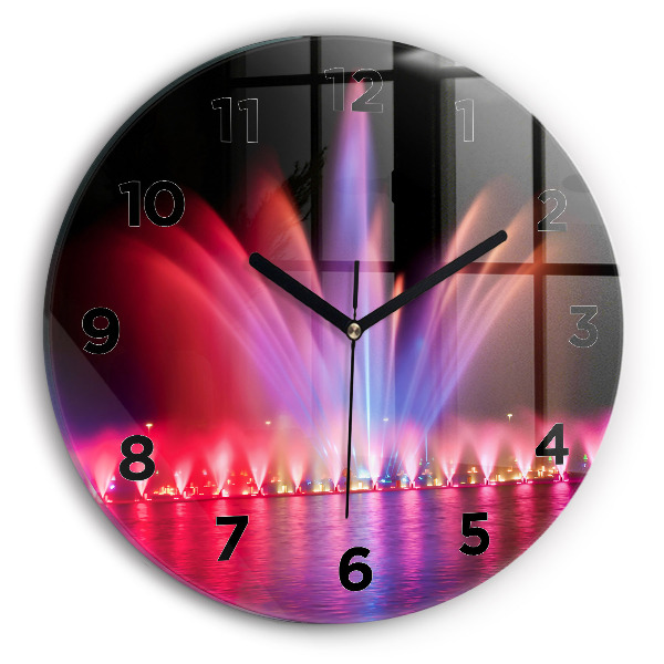Horloge ronde Fontaine de Wroclaw la nuit