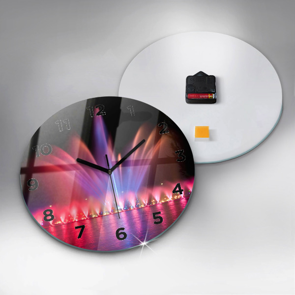 Horloge ronde Fontaine de Wroclaw la nuit