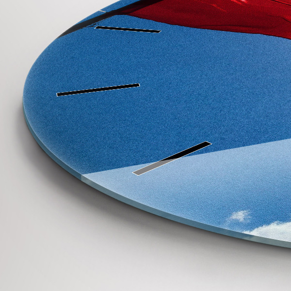 Horloge ronde Le drapeau polonais contre le ciel