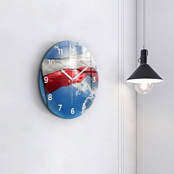Horloge ronde Le drapeau polonais contre le ciel