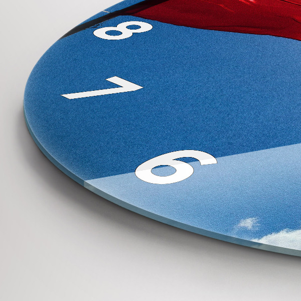 Horloge ronde Le drapeau polonais contre le ciel