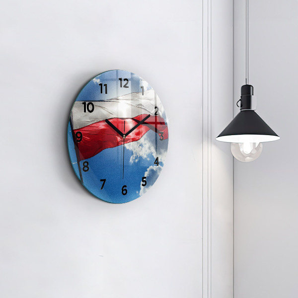 Horloge ronde Le drapeau polonais contre le ciel