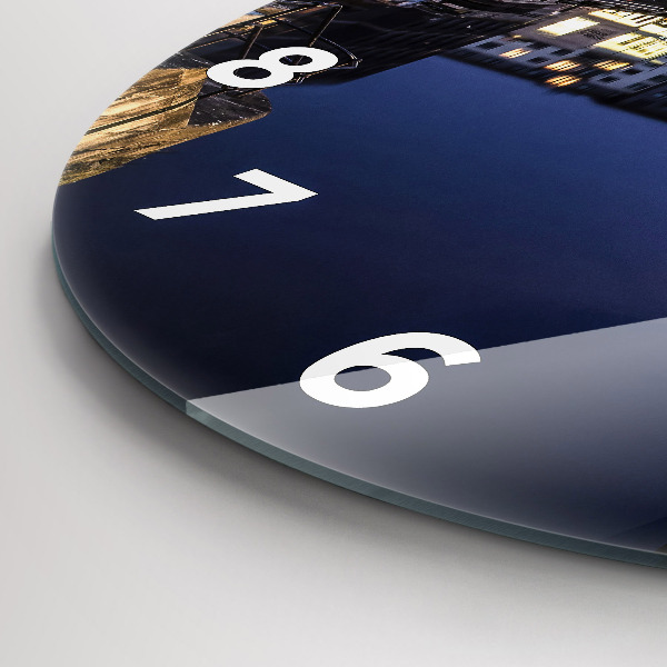 Horloge ronde La ville illuminée la nuit