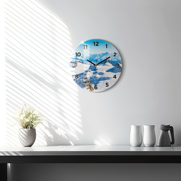 Horloge ronde Skieur dans les Alpes