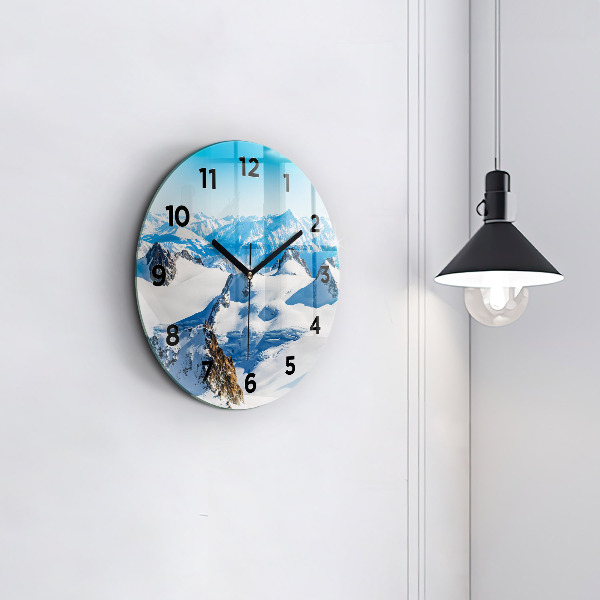 Horloge ronde Skieur dans les Alpes